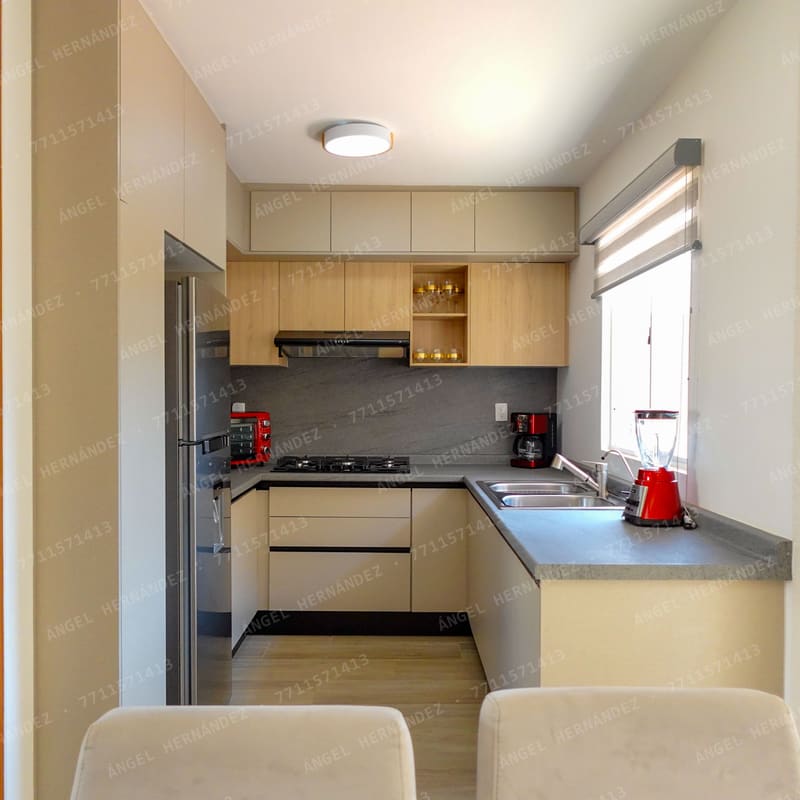 Cocina integral con barra desayunadora en modelo Gibraltar, Zapotlán de Juárez
